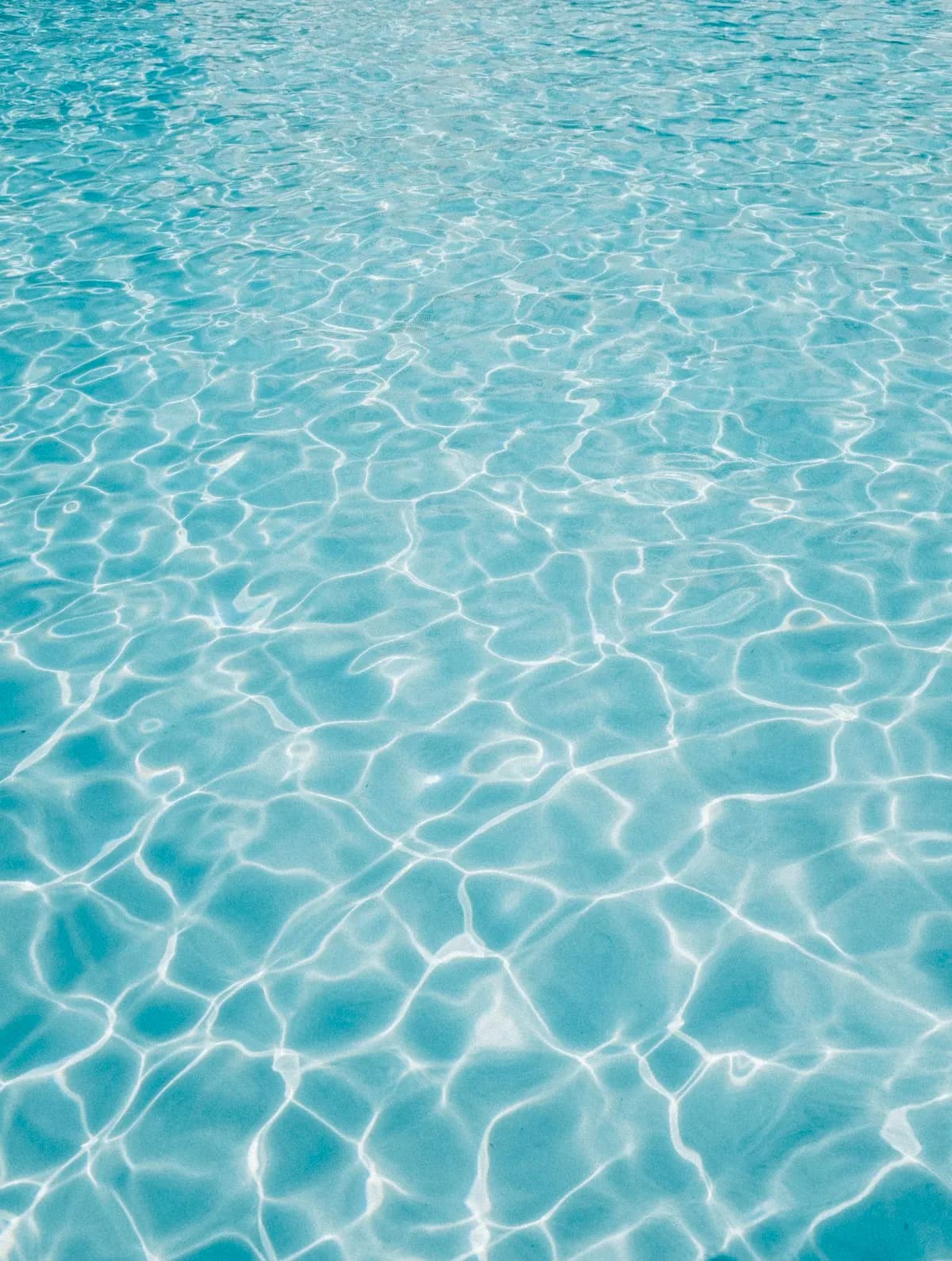 Pale blue pool water with ripples